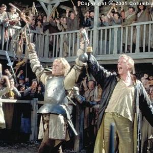 (From left to right) William (Heath Ledger) and Chaucer (Paul Bettany) celebrate one of the young knight's many victories on the tournament field