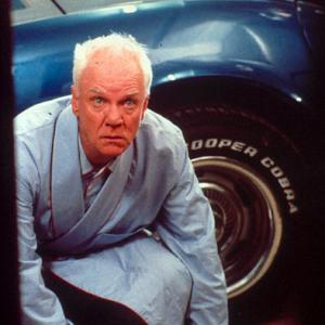 Still of Malcolm McDowell in I'll Sleep When I'm Dead (2003)