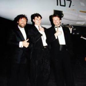 Don Simpson Tom Cruise and Jerry Bruckheimer with a fighter plane from Top Gun