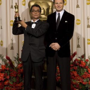 Academy Awardwinner Yojiro Takita left with presenter Liam Neeson backstage at the 81st Academy Awards are presented live on the ABC Television network from The Kodak Theatre in Hollywood CA Sunday February 22 2009