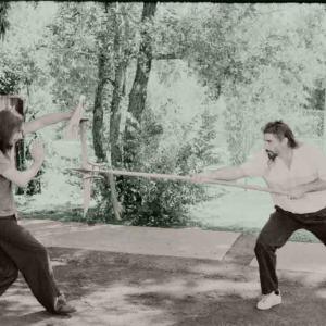 Buddha Z with Double-Crescent Spear versus Chinese Saber block by student Sam Persons. The hooks are great for grabbing an opponent's weapon, twisting the spear and pulling it out of their hands. Long weapons require different strategies than sword