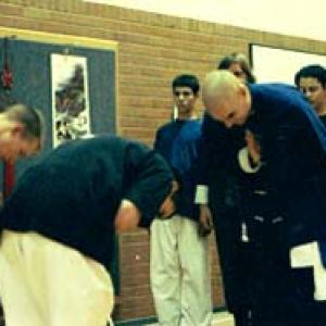 That's my bald head in 1997 receiving the Purple Patriarch Sash of Shaolin Chi Mantis. That's my daughter, 