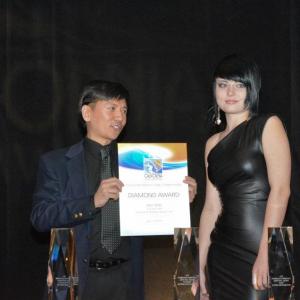 Cal Nguyen accepting the Television Productions Competition Diamond Award for his series Day Zero httpwwwdayzerotvcom Pictured with actress Deven Baldwin