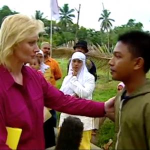 CNN Correspondent Alex Quade interviewing tsunami survivors in Bande Aceh, Indonesia, at site of mass grave. Surviving children searched for their dead parents and siblings at the mass grave.