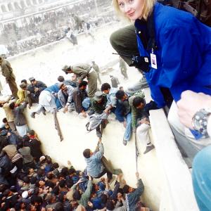 Crowds can quickly turn into riots. CNN correspondent Alex Quade covering Kabul, Afghanistan 2001/2002.