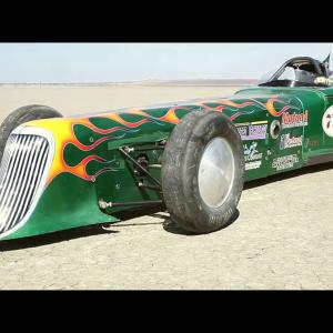 War Reporter Alex Quade about to drive land speed world record holder Gil GillisThe Extreme Freedom Special a modified roadster at El Mirage Dry Lake Bed California Gillis supports wounded warriors and asked to see if Alex could set a speed record