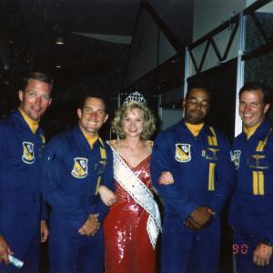 War Reporter Alex Quade with tiara and sash instead of helmet and flak-vest; as Miss Seafair with the Navy Blue Angels, before her career as a CNN Combat Correspondent in war zones. Seattle, 1990.