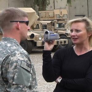 War Reporter Alex Quade interviewing Special Forces soldier in secret compound location, near Baghdad, Iraq, 2008.