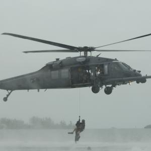War Reporter Alex Quade hoisted by Air Force helicopter and elite Pararescuemen for her 
