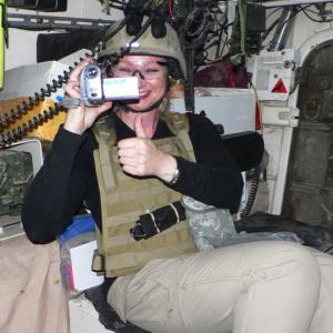 War Reporter Alex Quade on mission in Iraq. Inside Stryker vehicle on route to Combat Outpost Pirelli. 2008.