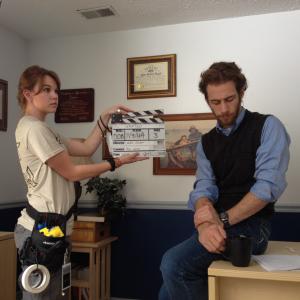Production still of 2nd AC Amelia Austin with Nathan Jacobson on the set of Wanted 2014