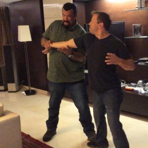 Steven Seagal and Ron Balicki going over choreography for their fight scene in Absolution.
