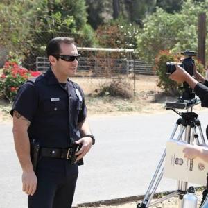 As OFFICER LOPEZ on the set of Emily Foster PI web series.