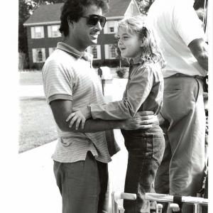 Drew Barrymore and director Mark L. Lester on the set of 
