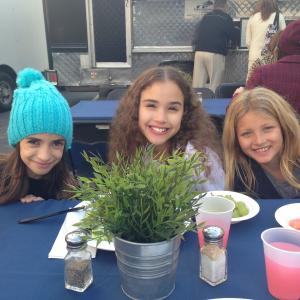 Actresses L to R Soni Bringas Gracie Haschak and Ryan Baumann break for lunch while starring in the AMERICAN GIRL  Isabelle Girl of the Year 2014 doll commercial Dec 2013