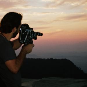 Still of Vincent Biscione on Corcovado Mountain in Rio de Janeiro, shooting with a 16mm Bolex