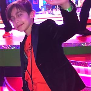 Aidan Gallagher at the 2014 Nickelodeon Kids Choice Awards. Hair by Stephanie Lewis, custom velvet tuxedo jacket by John Varvatos, environmental tshirt by Kitson Malibu, skinny jeans by Joes Jeans.