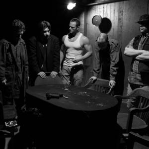 Jeffrey Kelley Center in White tshirt pictured with cast mates Josh Gaudet Ian Estey Scott Brownlee and Jon Blizzard in a still shot from the set of FIVE
