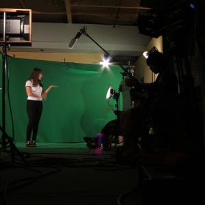 Actor, Ariel Bryan filming a scene.