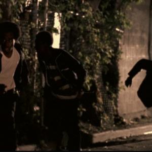 Movie Scene Redemption The Stan Tookie Williams Story  Actor Michael A Amos running in an street alley