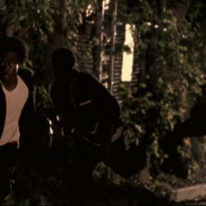 Movie Scene Redemption The Stan Tookie Williams Story  Actor Michael A Amos running in an street alley