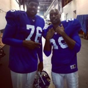 Standing with Morris Chestnut (right) after the final football scene of 
