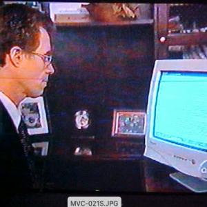 Dr Fleming on 2020 showing results to film crew on the computer
