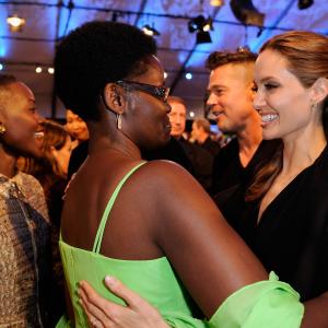 Actress Lupita Nyongo mother Dorothy Nyongo and actors Brad Pitt and Angelina Jolie onstage during the 2014 Film Independent Spirit Awards at Santa Monica Beach on March 1 2014 in Santa Monica California