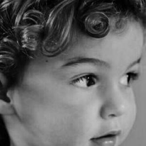 Zac england age 21 months has curly hair and is not shy to have his photo taken