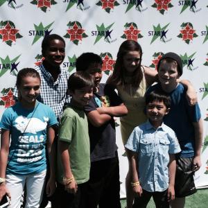 Prophet on the green carpet with the cast of Fresh Off The Boat at the 15th Annual Star Eco Stations Childrens Earth Day event