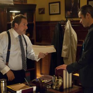 Still of Timothy Olyphant and Stephen Root in Justified 2010