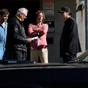 FROM L TO R: Christopher Sommers, Brian Trenchard Smith, Thomas Jane and John Cusack talk through a scene from Drive Hard