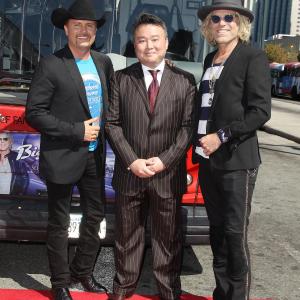 David W Chien poses with Ride of Fame honoree country music duo Big  Rich September 26th 2014