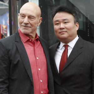 David W Chien poses with Sir Patrick Stewart at Ride of Fame December 4th 2013