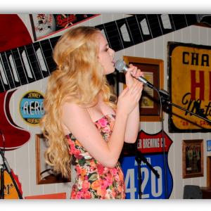 Singing originals in a songwriting competition at the Wild Wing Cafe, Nashville