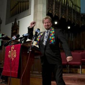 United Methodist pastor Frank Schaefer does a dance step after a reporters question as the Rev Lorelei Toombs left looks on during a news conference Tuesday June 24 2014 at First United Methodist Church of Germantown in Philadelphia