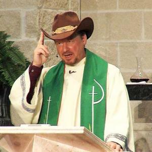 Rev Frank Schaefer dons a cowboy hat while speaking at the Cathedral of Hope in Dallas TX February 2014