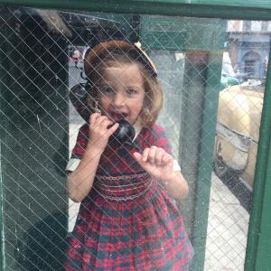 Sunnie having fun in an old phone booth on set for the 200th episode