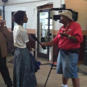 Lora being interviewed on the set of 42 The Legend Of Jackie Robinson