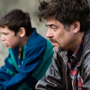 Still of Benicio Del Toro and Eldar Residovic in A Perfect Day (2015)