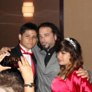 Still of BrenDen Polar with his father and his cousin Julia at her Quinceañera.