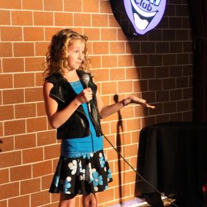 Jolie performing stand up comedy at the HaHa Cafe in North Hollywood