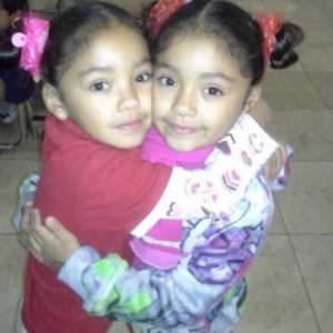 Nalena & Lavena hugging at school