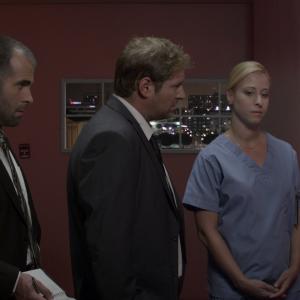 Nurse Becky briefs detectives Sherman and Snyder. Art Hall as Dt. Snyder, Jayson Gladstone as Dt. Sherman and Lara Starr Rigores as Nurse Becky in 