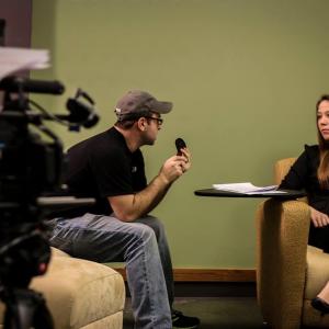 Director Johnathan Paul going over a scene with actress Elizabeth Morris