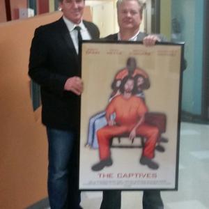 Joseph Wilson with Directorproducer Allen carver holding the movie poster of The Captives at the Filmmaker premier in Nashville2015
