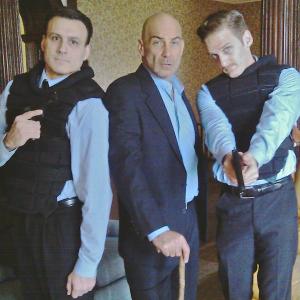 Agents Fidelio and Koldonski pose with Mr Drummond portrayed by David Dayan Fisher Dark Knight Rises National Treasure