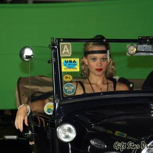 Lucianna on set in a vintage ride!