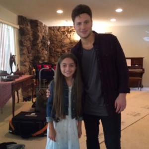 Gracie with singersongwriter Jamie Scott on set of her music video Unbreakable