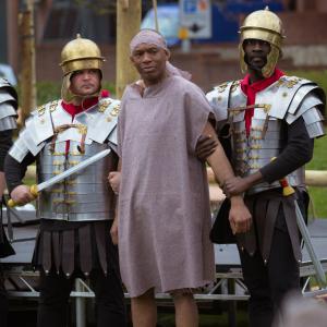 David Olawale Ayinde as Barabbas, held by two armed soldiers in the Re-enactment of The Passion of Jesus Christ Play 2015